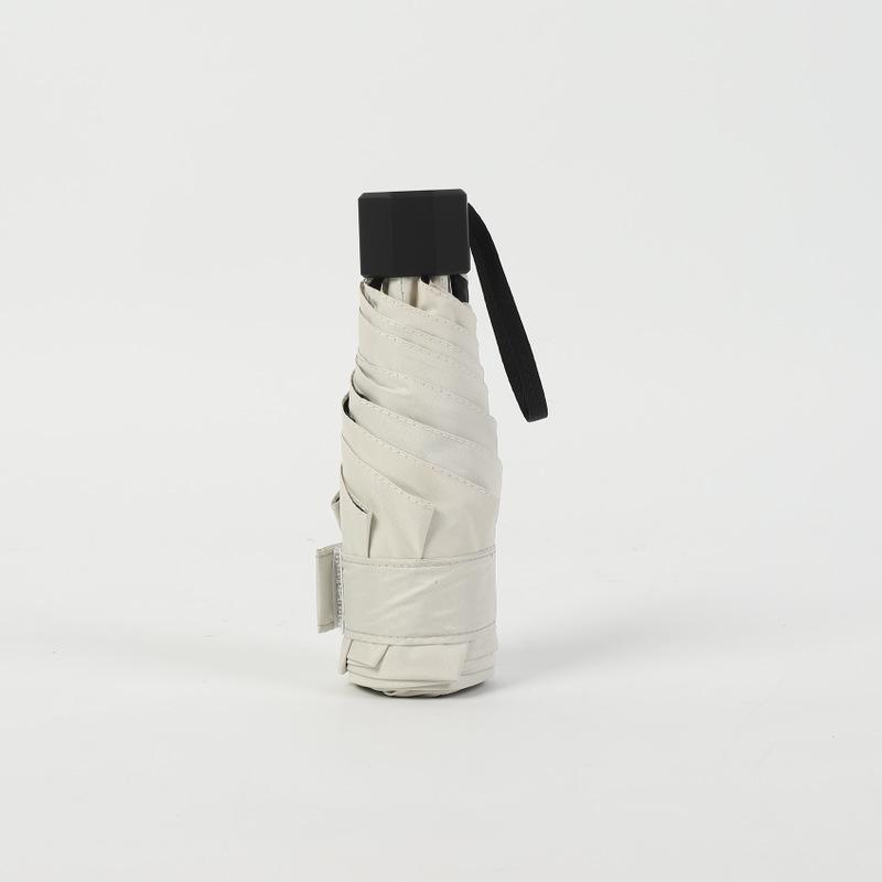 Kompakter UV-Schutz-Doppelnutzungs-Schirm für Sonne und Regen, Tragbarer Falt-Sonnenschirm mit aufgedrucktem Design