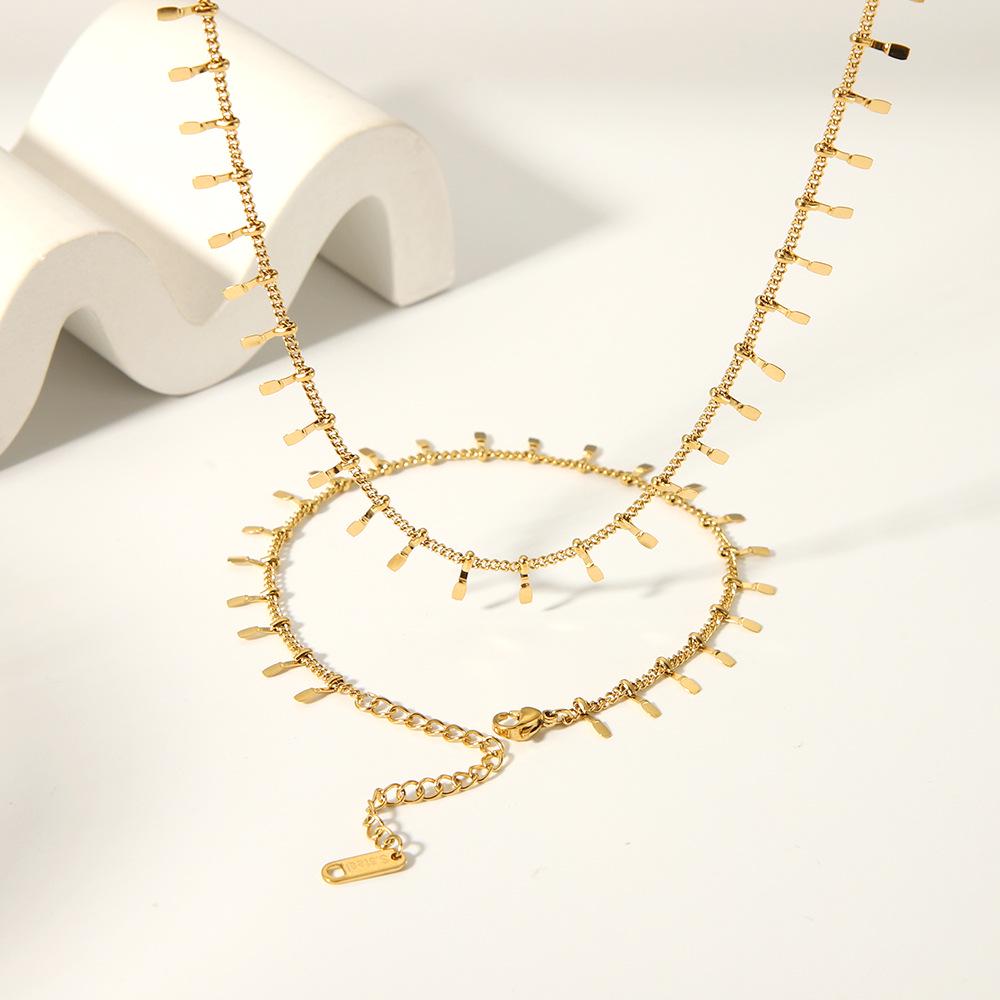 High-End European & American Tassel Choker: 18K Gold Stainless Steel Necklace & Clavicle Chain Bracelet for Women.