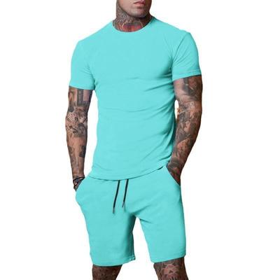 Conjunto de Camiseta de Manga Corta y Pantalones Cortos de Color Sólido para Hombre de Verano - Transpirable y Elegante.