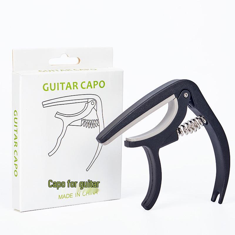 Plastic Guitar Capo with Built-in Pick Holder and Transposer Function English Version