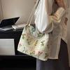 Borsa a tracolla ricamata di grande capacità Borsa estiva alla moda in tessuto da donna Borsa a tracolla con ricamo di nicchia Borsa a secchiello con texture Borse in tela