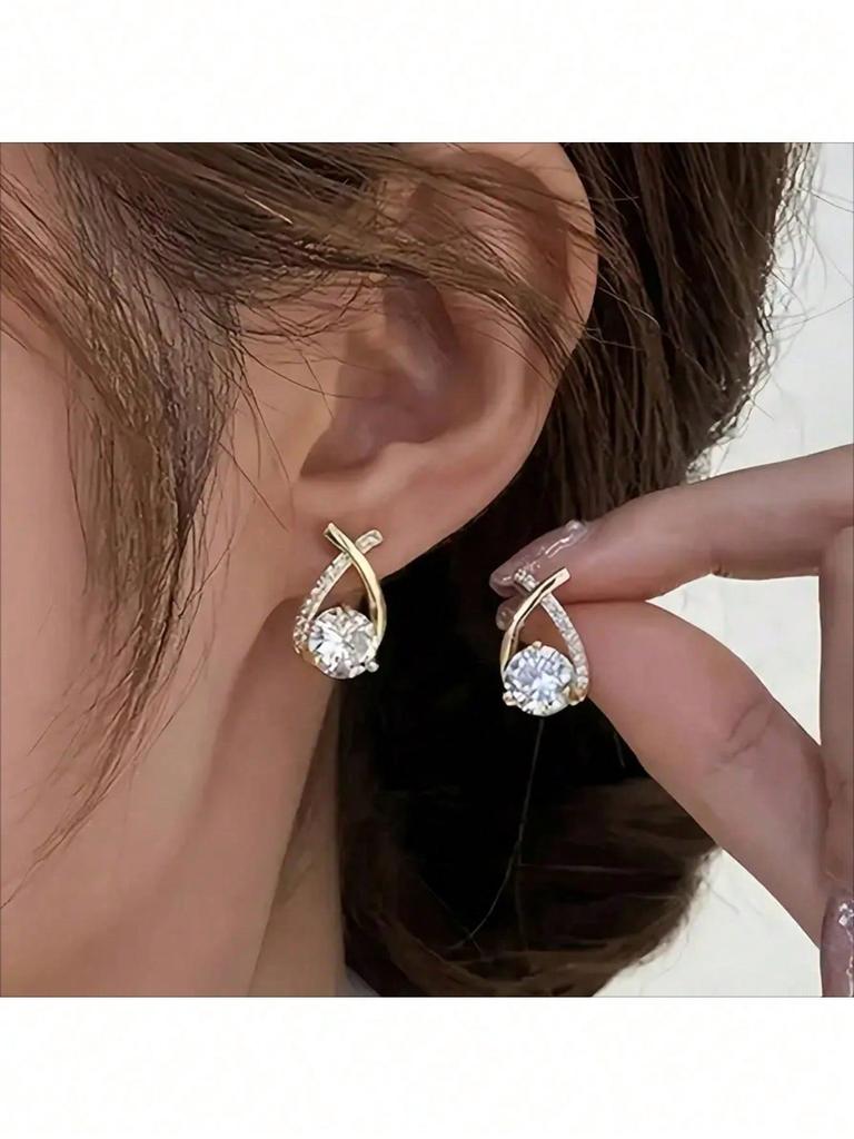 Gold Tone Teardrop Stud Earrings With Criss-Cross Cubic Zirconia Accents, Elegant Round-Cut Center Stone For Maximum Sparkle Comfortable Design