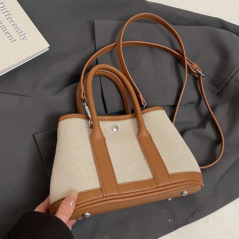 

Популярная в этом году нишевая модная корейская версия темпераментных контрастных цветов, портативные сумки-ведра, универсальная повседневная сумка-мессенджер для поездок на работу