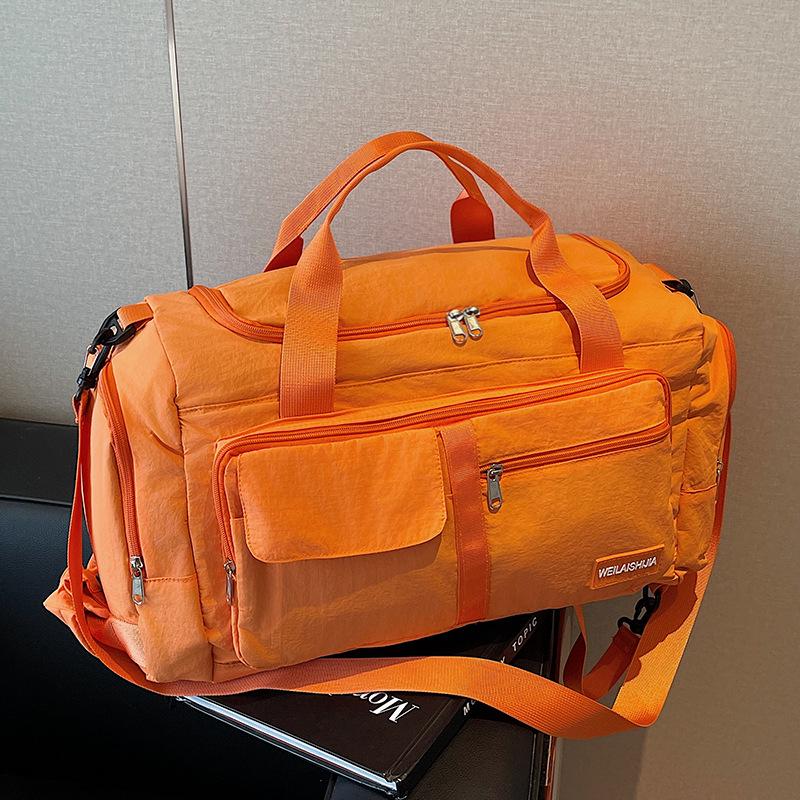 Large Capacity Waterproof Lightweight Travel Bag for Men and Women - Fashionable Handheld Storage for Short Trips and Sports.