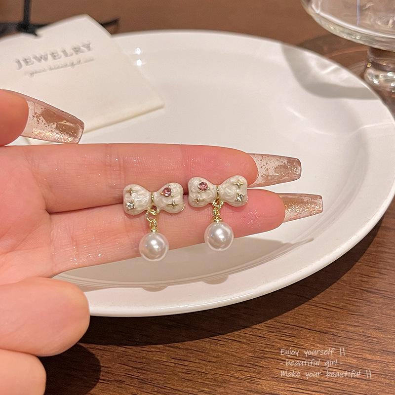 

Elegant S925 Silver Bow Earrings with Drip Glaze and Pearls - Light Luxury and Cute Design. A1672 золотой