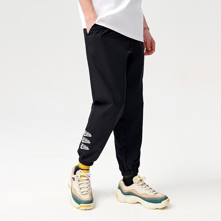 FILA Fusion Loose Fit Sports Printed Woven Tapered Pants Autumn Men pants Deep-Black T11M122805FBK