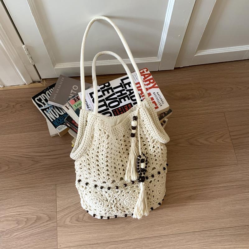 

Модная плетеная сумка-шоппер с кисточкой из деревянных бусин, новая полая соломенная сумка, пляжная сумка в отпускном стиле, универсальная женская сумка