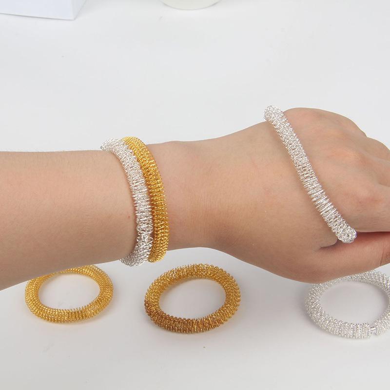 

Spring Steel Bangle: Gold & Silver Wrist Massage Toy