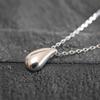 This Genuine 925 Sterling Silver 18K Teardrop Charm Necklace Features a Minimalist Design and a Small It Comes with a Drawstring Pouch and Is a