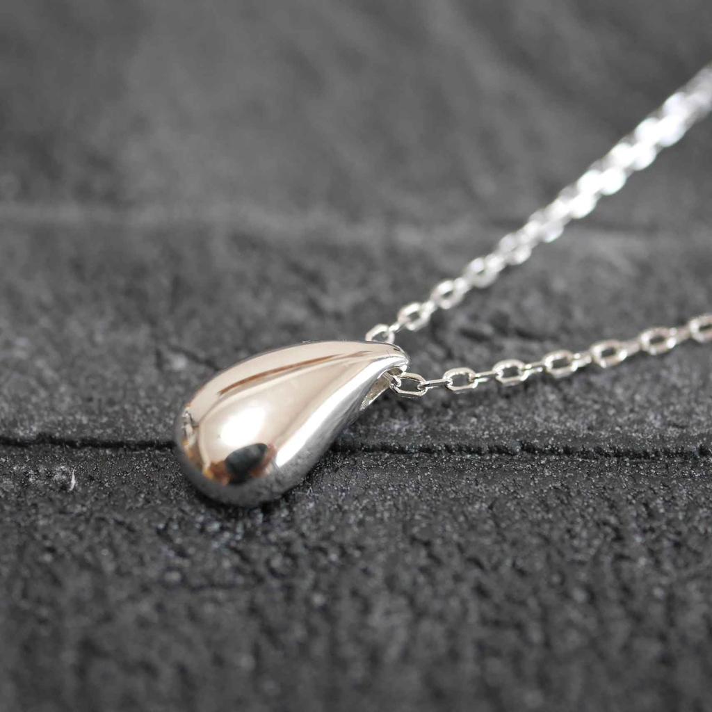 This Genuine 925 Sterling Silver 18K Teardrop Charm Necklace Features a Minimalist Design and a Small It Comes with a Drawstring Pouch and Is a