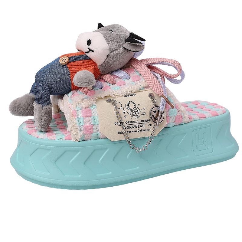 Cartoon doll thick-soled one-word slippers female summer design sense cute fringed beach shoes flat-soled semi-drag cool slippers