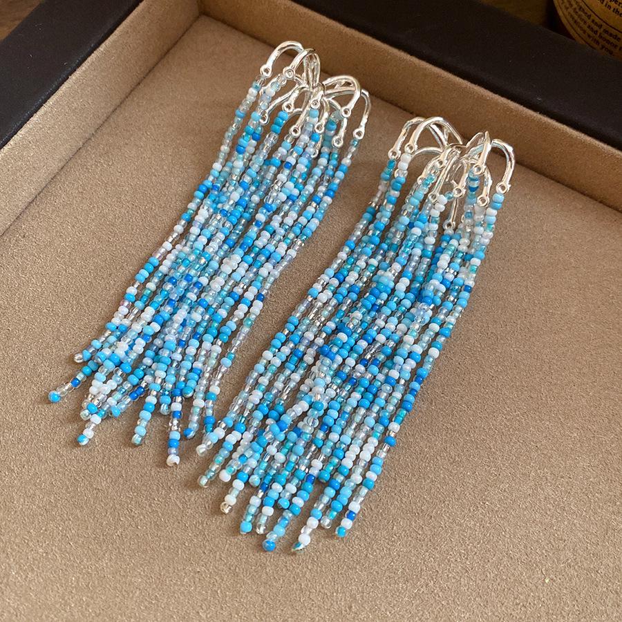 

Silver needle glass bead fireworks fringed earrings new bohemian temperament stud earrings niche high-end earrings