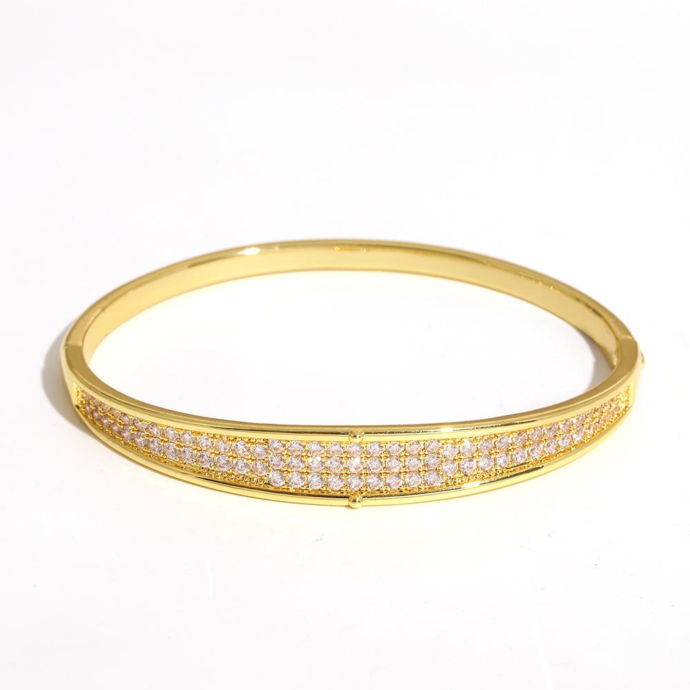 Luxuriöses funkelndes Strass-Armband, goldplattiert, für Damen, exquisites unregelmäßiges geometrisches Schleifenmanschetten-Federarmband Schmuck
