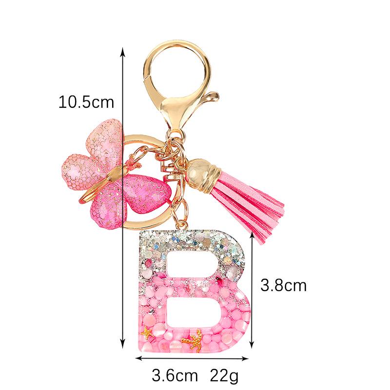 Pink Epoxy Letter Keychain with Sequin Butterfly & Tassel Charm