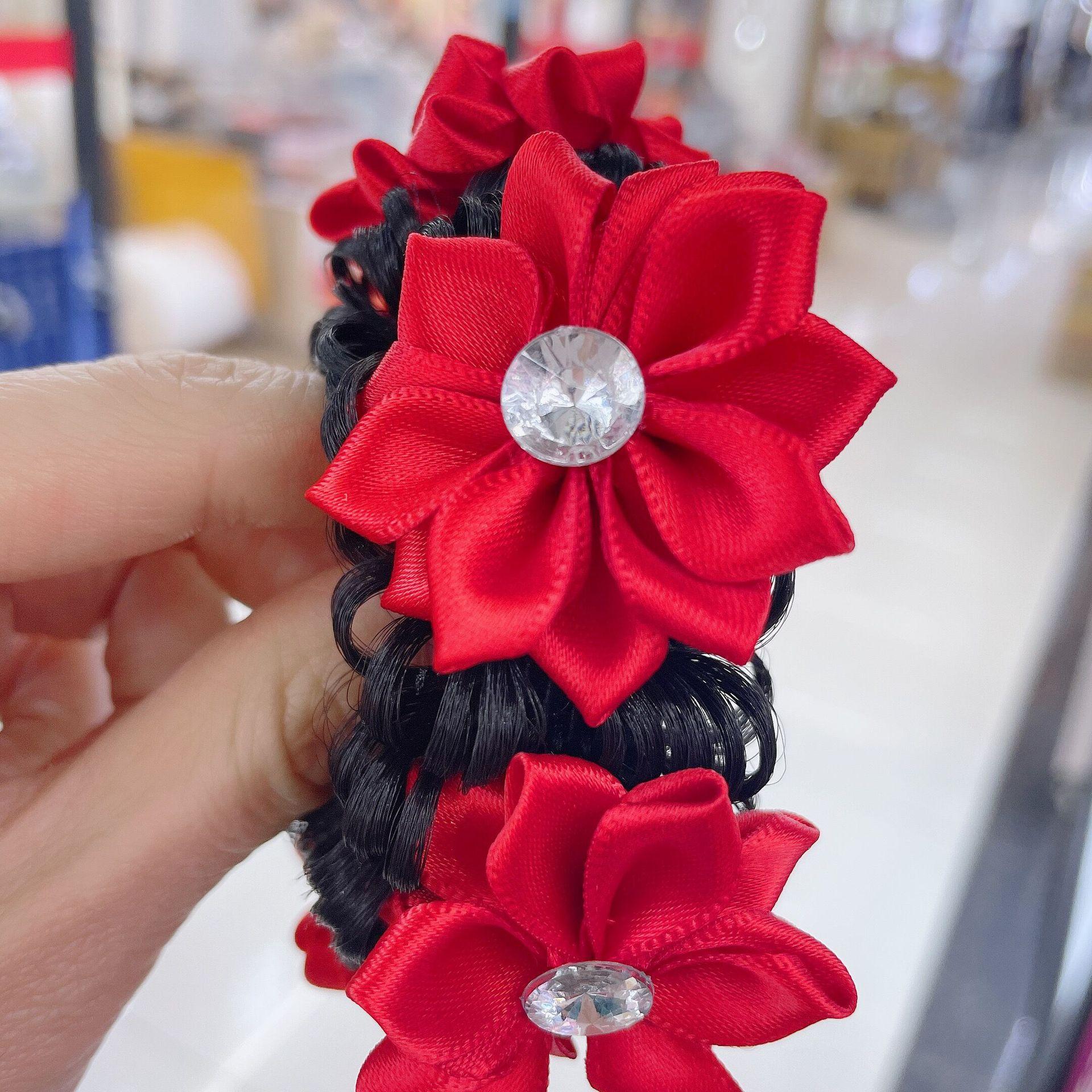 

Children s festive hair accessory, a large red flower hairband for kids, suitable for celebratory updo hairstyles.