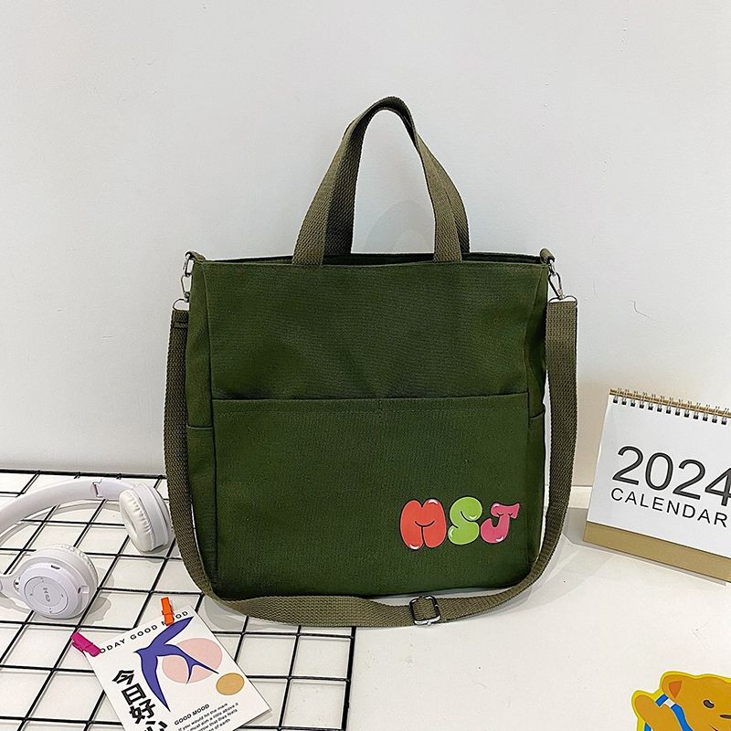 

Class commute shoulder Korean version of versatile tote bag student 2025 new large-capacity versatile messenger canvas bag зелёный