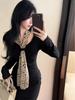 Elegant Leopard Print Waist-Cinching Long-Sleeve Pleated Top with Ribbon Detail