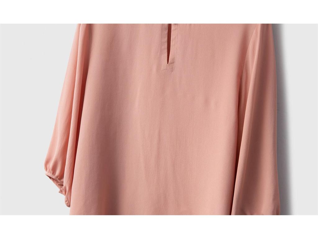 Women's Solid Color 100% Mulberry Silk Double Georgette Lantern Sleeve Top with Round Neck and Side Slits.