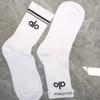 ALO Cotton Yoga Socks: Mid-High, All-Season Sports Socks with Trendy Packaging for Autumn and Winter.