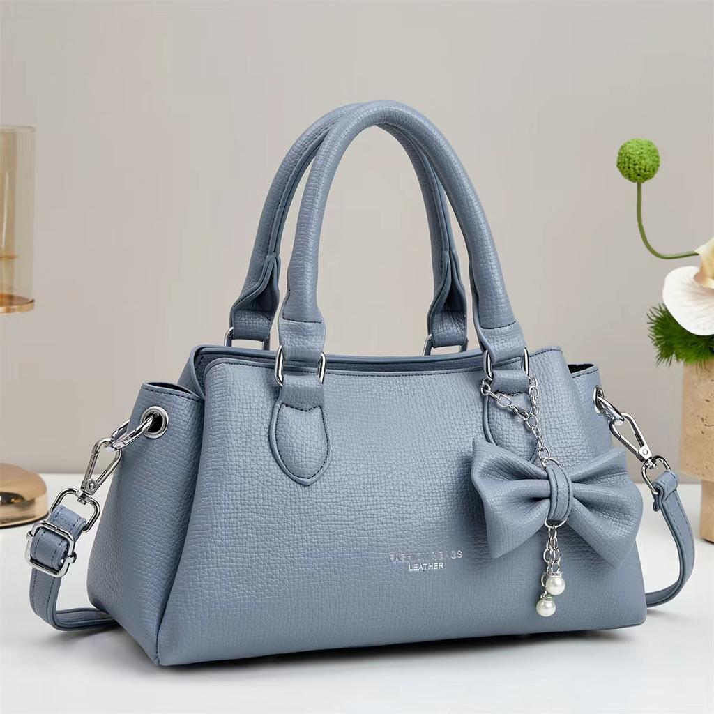 Sensitive lychee pattern Korean fashion shoulder bag large capacity multi-layer butterfly pendant commuter versatile messenger bag