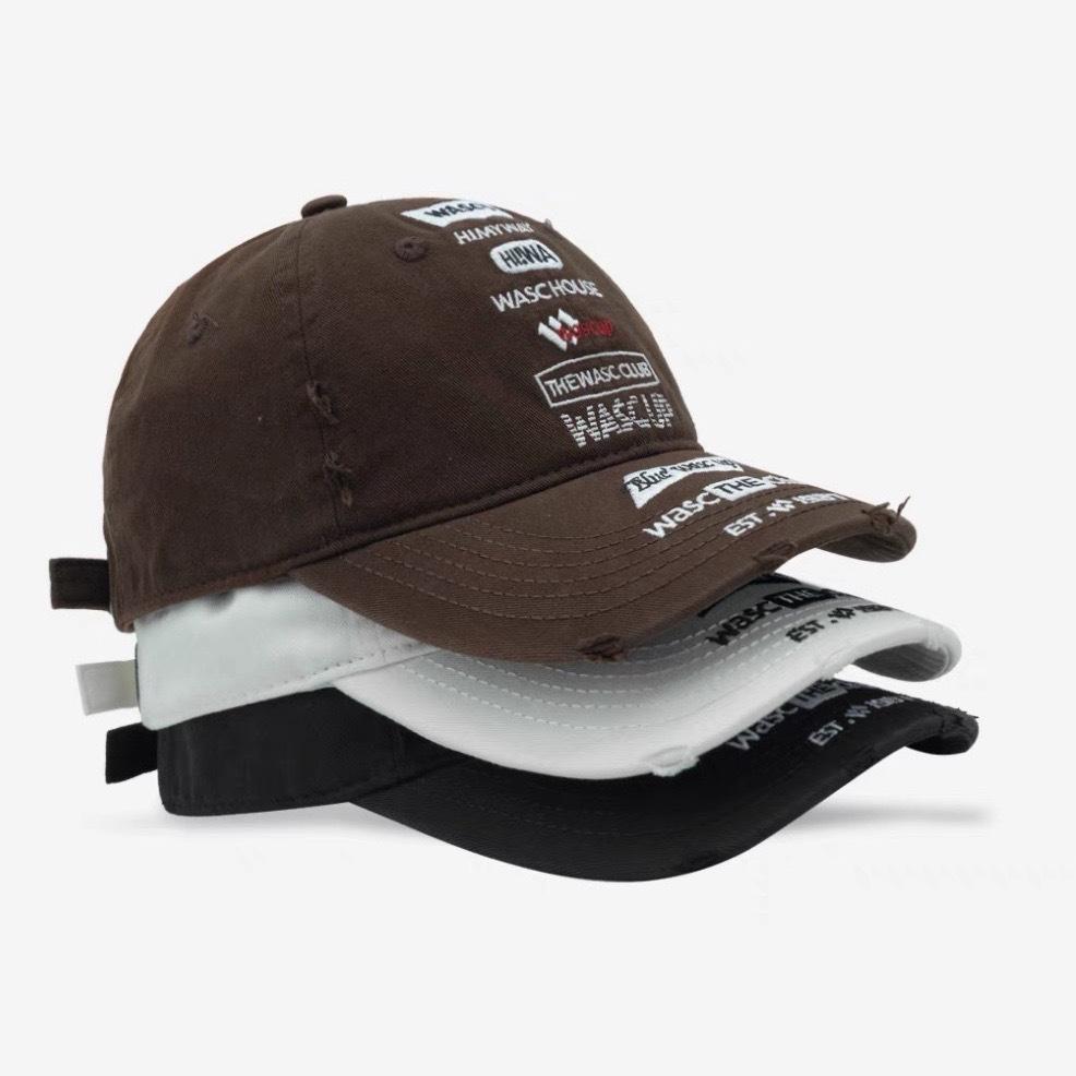 A Female Soft Top  Heavily Distressed  Embroidered Letter Couple Baseball Hat  and A Male with A Smaller Face