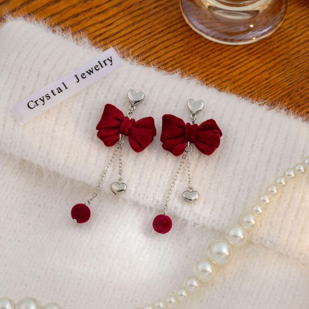 Boucles d'oreilles pendantes cœur avec nœud floqué haut de gamme et longues pampilles pour femmes