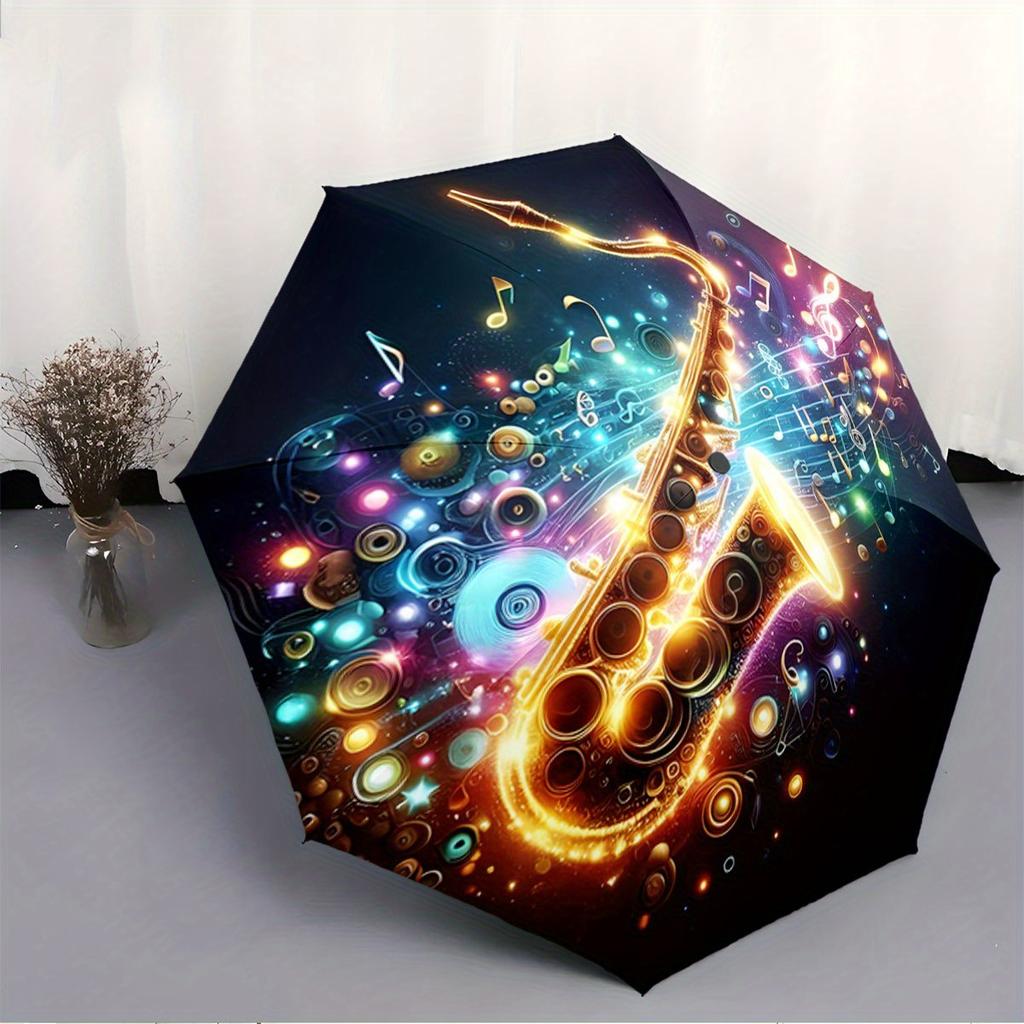 Automatic Folding Umbrella The umbrella features a vibrant saxophone surrounded by musical notes and colorful swirls. Portable