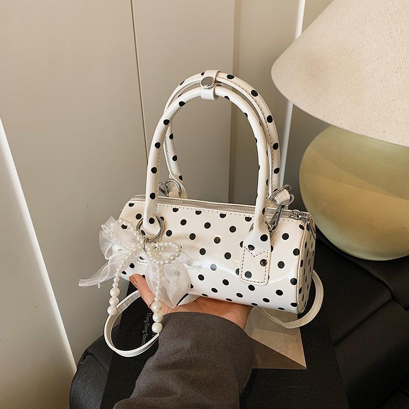 Niche design bag women's 2025 new summer shoulder messenger bag polka dot portable cylinder bag