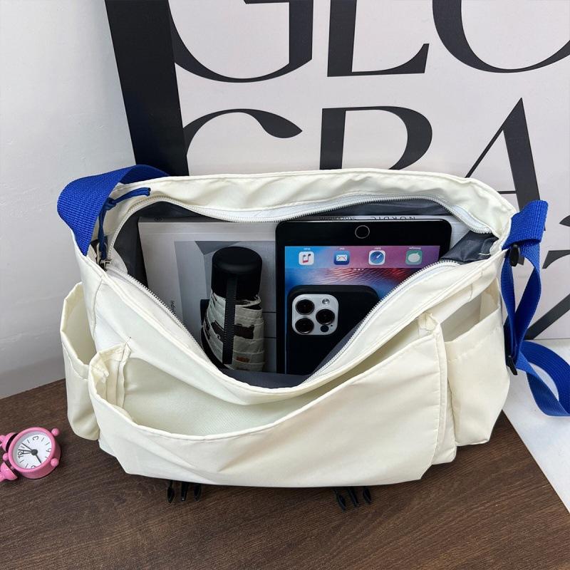 Large capacity tooling multi-pocket messenger bag leisure student shoulder versatile messenger bag solid color anti-splashing women's bag