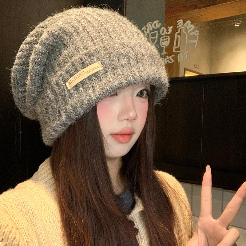 Gray knitted wool hat women's winter versatile warm pile hat showing face small cold hat ear protector bag head hat