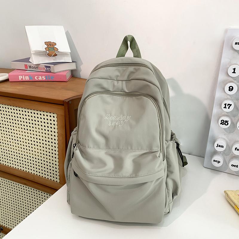 Jednobarevný školní batoh pro studenty nižší střední školy s velkou kapacitou, dámský batoh s výšivkou písmen