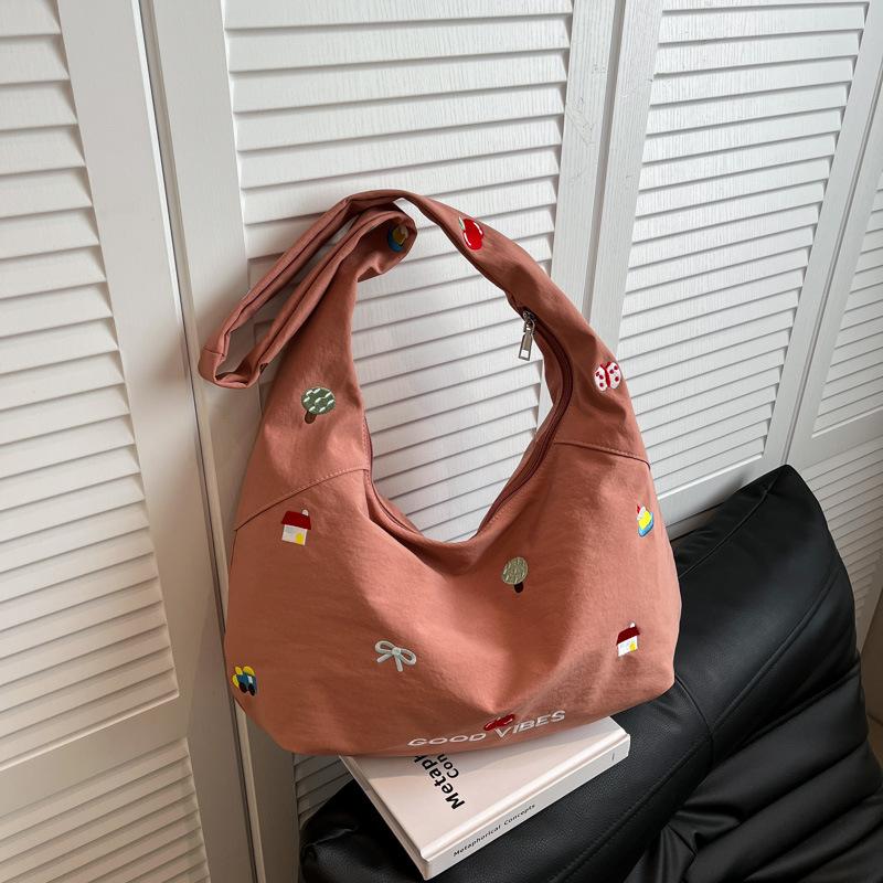 

Embroidered nylon bag messenger bag women s new niche design sense large capacity commuter shoulder bag tote bag розовый