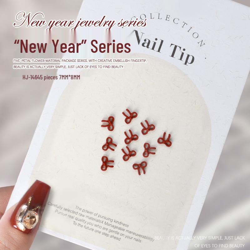 

Набор для украшения ногтей к Новому году: Красный бант, Сердце, Жемчуг, Галстук-бабочка, Цветок камелии - 5 шт.