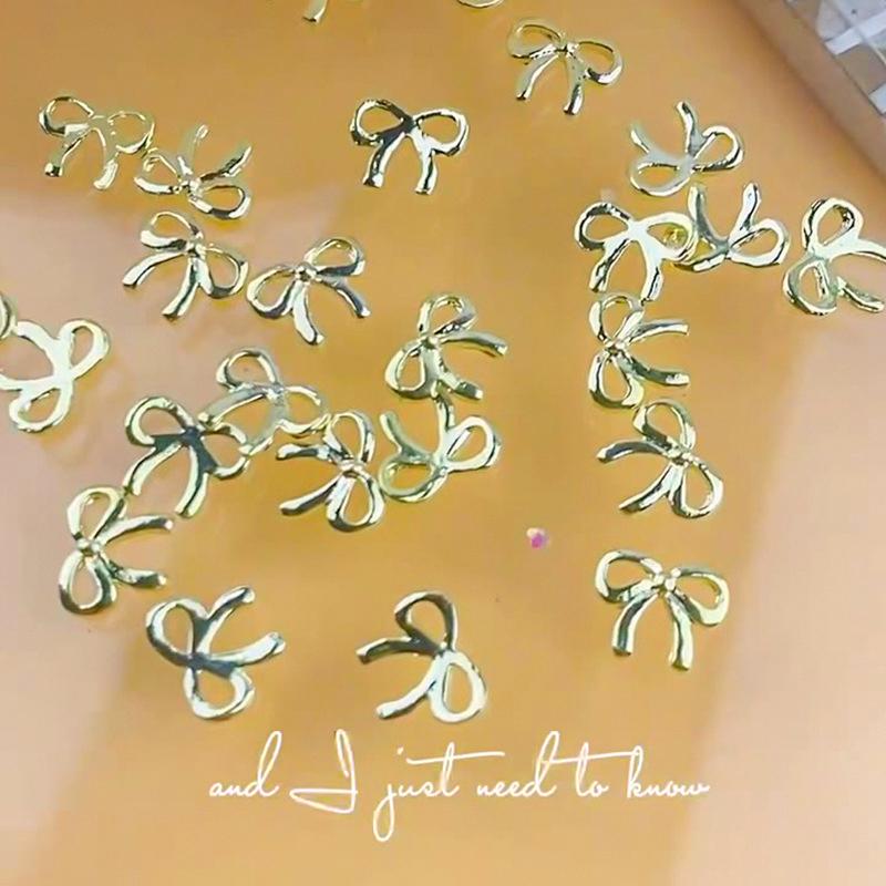 5 Stuks/Zak Elegante Legering Strik Nagel Charms 3D Metaal Zilver Goud Champagne Goud Licht Luxe Holle Strik Super Fee Nagellak Accessoire