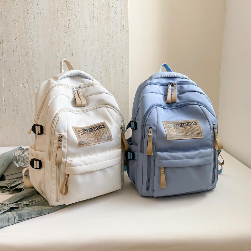 Sac à dos 1011 grande capacité hommes et femmes style loisirs sports sac à dos simple pour élèves du collège version coréenne sac de voyage