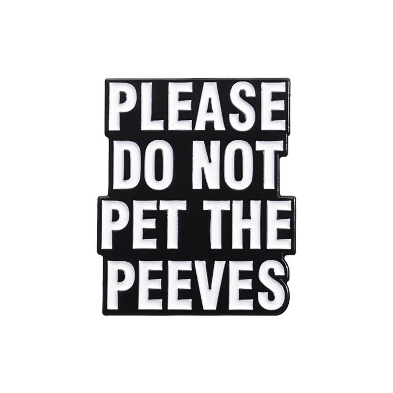 

Black And Stylish White Lettered Brooch With Enamel Finish Perfect For Fashion Accessories