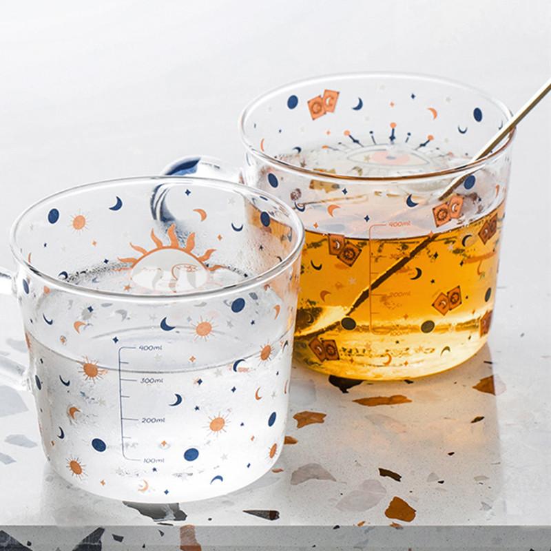 Taza de Vidrio Abstracta con Patrón de Sol y Ojo de 500ml con Asa Taza Creativa para Desayuno Café Jugo Té con Escala