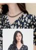 V-neck printed twisted waistband bubble sleeve T-shirt for women in 2026 summer, slim fit and stretchy commuting top