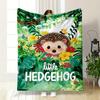 A Cute Hedgehog Surrounded by Vibrant Flowers and Lush Greenery. for All Seasons Blanket Lunch Break Throw Gift