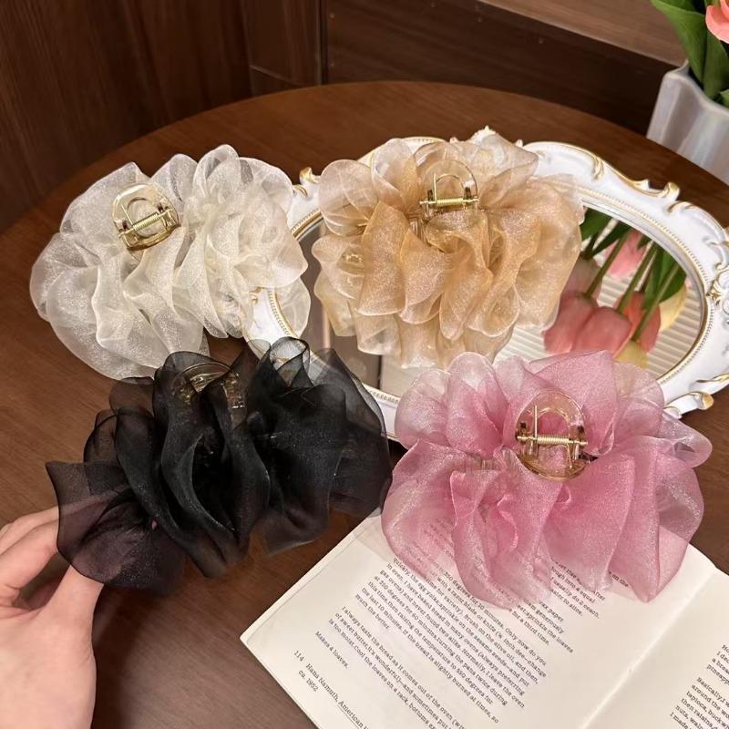 The Mesh Grabber Is Elegant and Feminine with A Lot of Hair On The Back of The Head. It Is A Shark Clip Hair Accessory