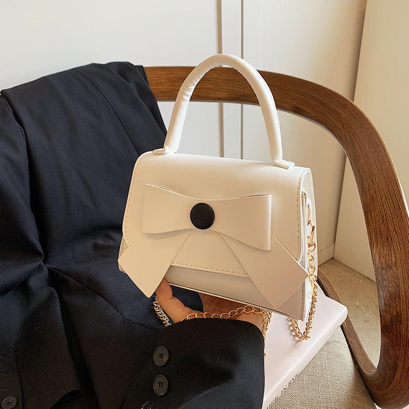 

Crossbody bag women s 2025 new fashion niche design cute bow portable small square bag work hand bag белый