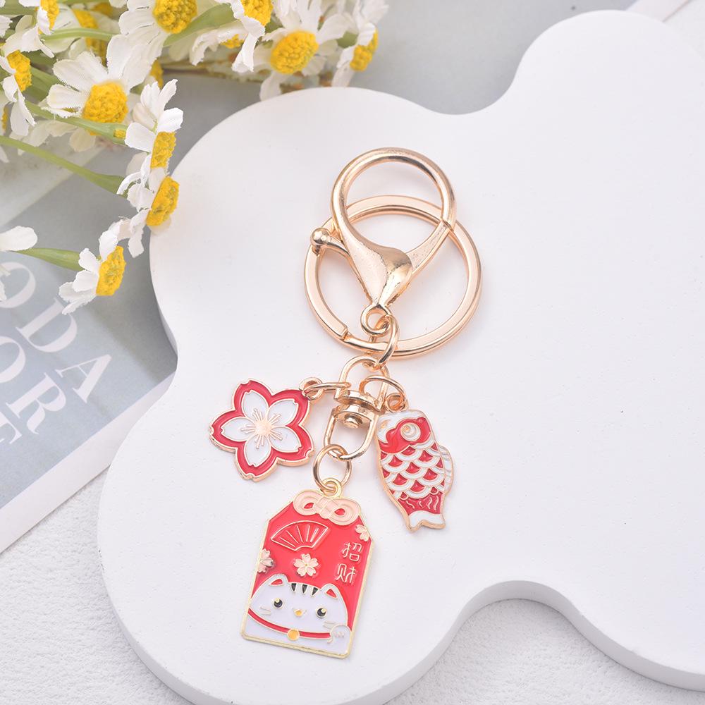 Japanese Sakura Koi Omamori Amulet Keychain for Luck, Wealth & Safety - Charming Couple's Accessory