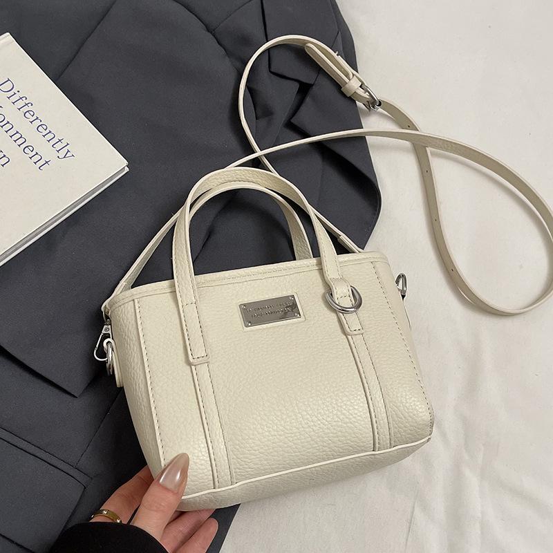 Spring hot sale lychee pattern high-end portable bucket bag Korean version casual small fresh temperament versatile messenger women's bag