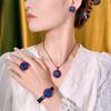 Autumn and winter new Huabi jewelry copper bottom gold-plated simulation blue spinel advanced sense black gold set main stone 16-10m