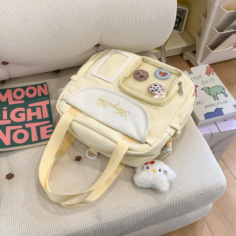 Japanische Schmerzbeutel Umhängetasche Damen Neue modische große Kapazität tragbare Tragetasche vielseitige Studenten-Schultertasche Trend