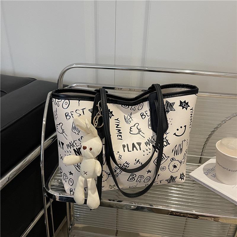Printed fashion commuting large capacity new personalized pendant autumn popular casual shoulder tote bag