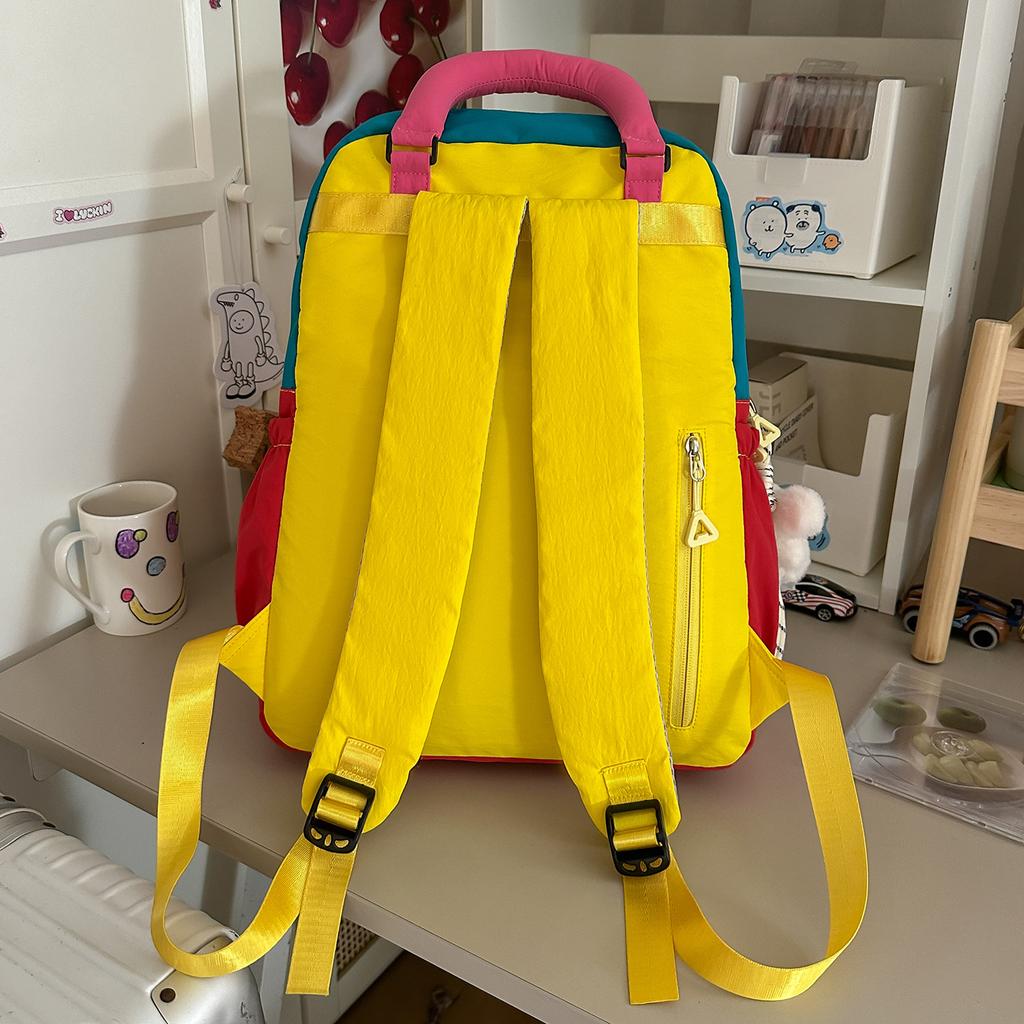 Schoolbag bright yellow contrasting color dopamine splicing backpack college student Korean vitality wind short trip shopping play backpack