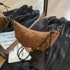 Neue koreanische Nischen-Croissant-Tasche für Damen Sen Meng lässige einfache Umhängetasche Knödeltasche tägliche Pendler-Handytasche
