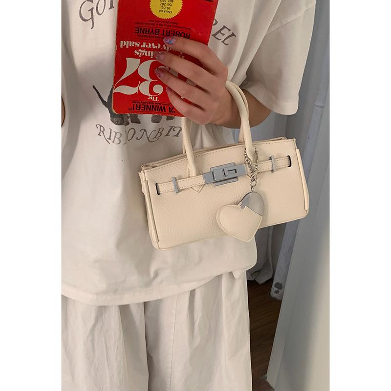 

Korean version niche texture handbag women s bag 2025 new large-capacity platinum bag fashion messenger commuter bag бежевый