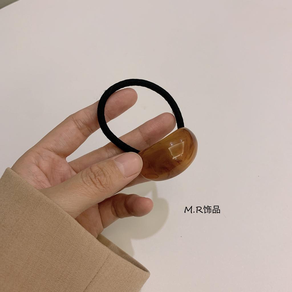 Ein schlichter und eleganter, kalter Stil Acryl-Bogenförmiger Lederband-Kopfschmuck für Damen